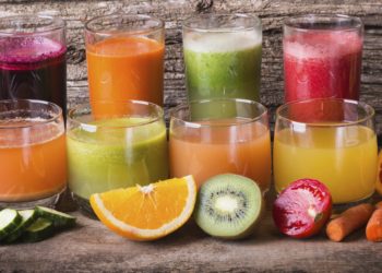 Healthy fruit & vegetable juice on wooden background