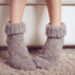 female legs in woolen socks close up
