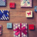 Different color gift boxes on wooden background