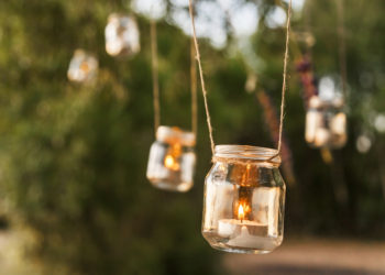 mason jar candle hanging on tree for wedding decor